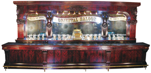 Front and back bar with original matching liquor cabinet by Brunswick, Balke & Collender Co. ($302,500, a record). Image courtesy Showtime Auction Services.